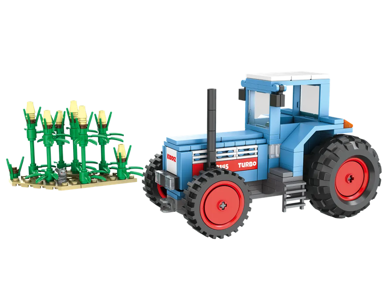 Der Turbo Tracktor aus Klemmbausteinen mit einem Feld und zwei Kiddiz Minifiguren